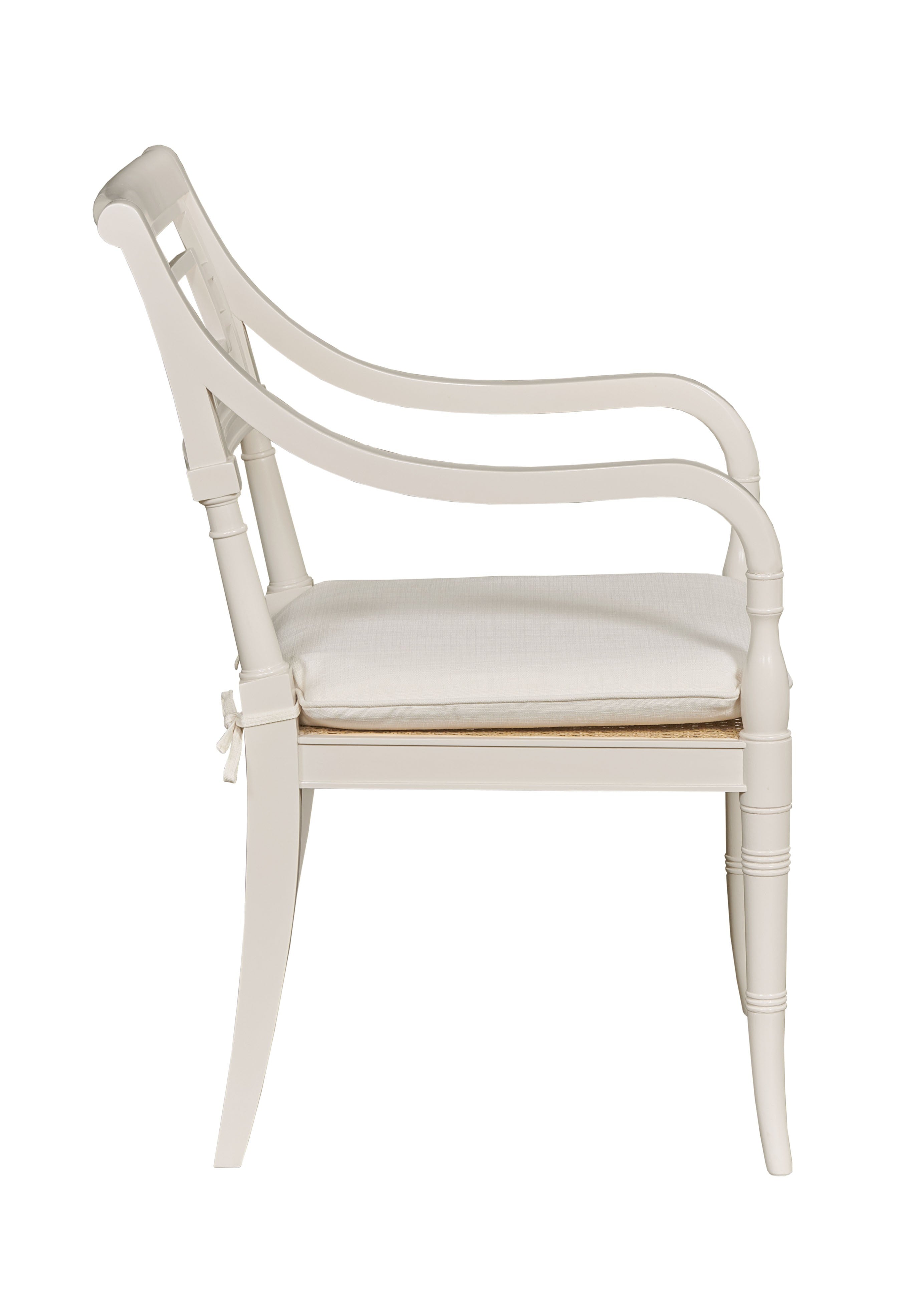 White armchair with a cushion on a white background