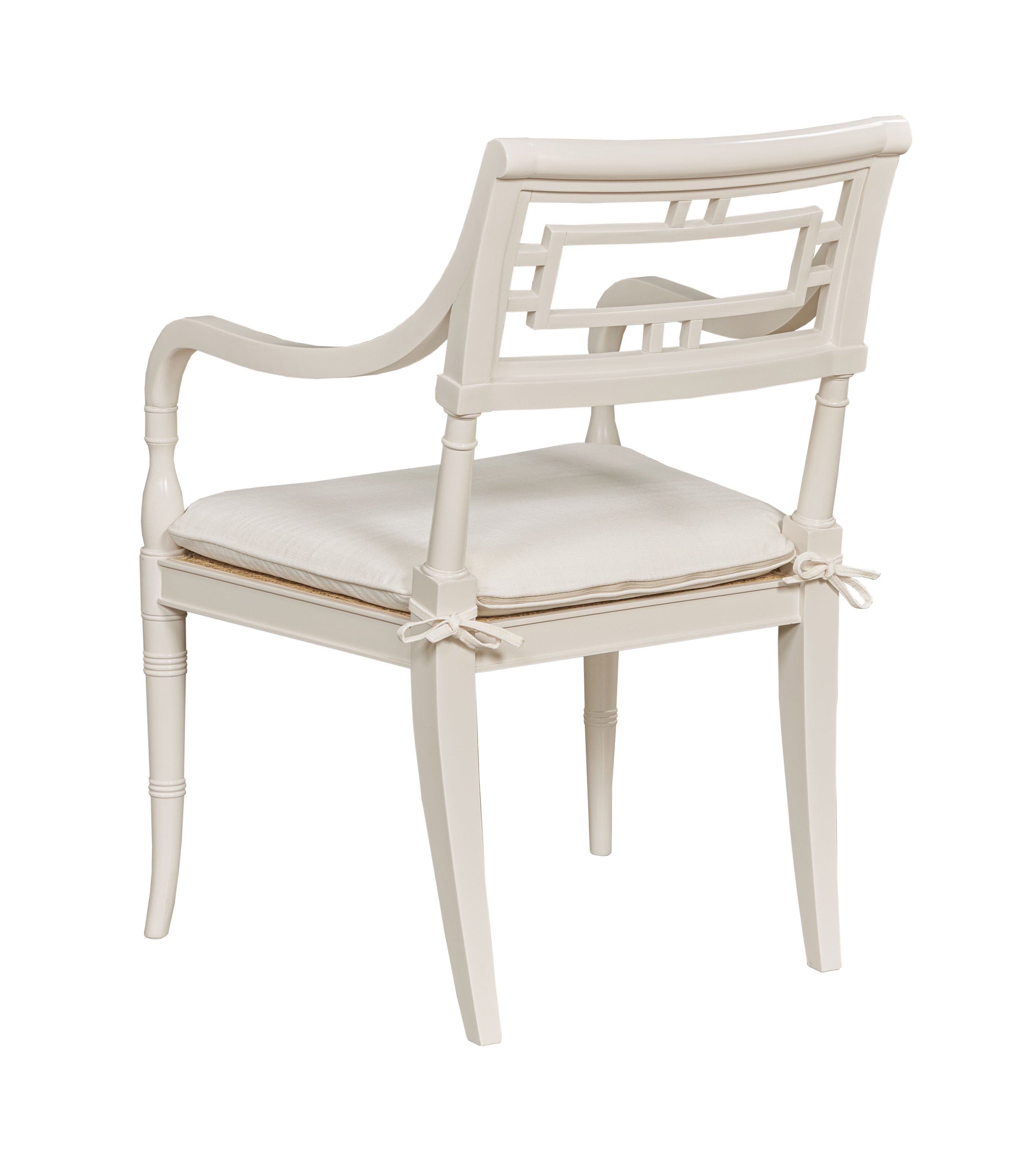 White chair with a cushion on a white background