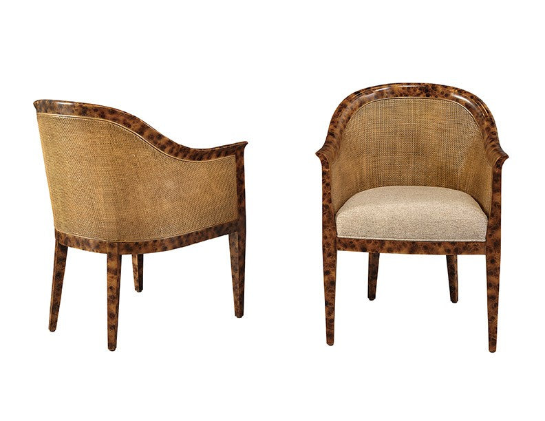 Two ornate chairs with wicker backrests and wooden frames on a white background