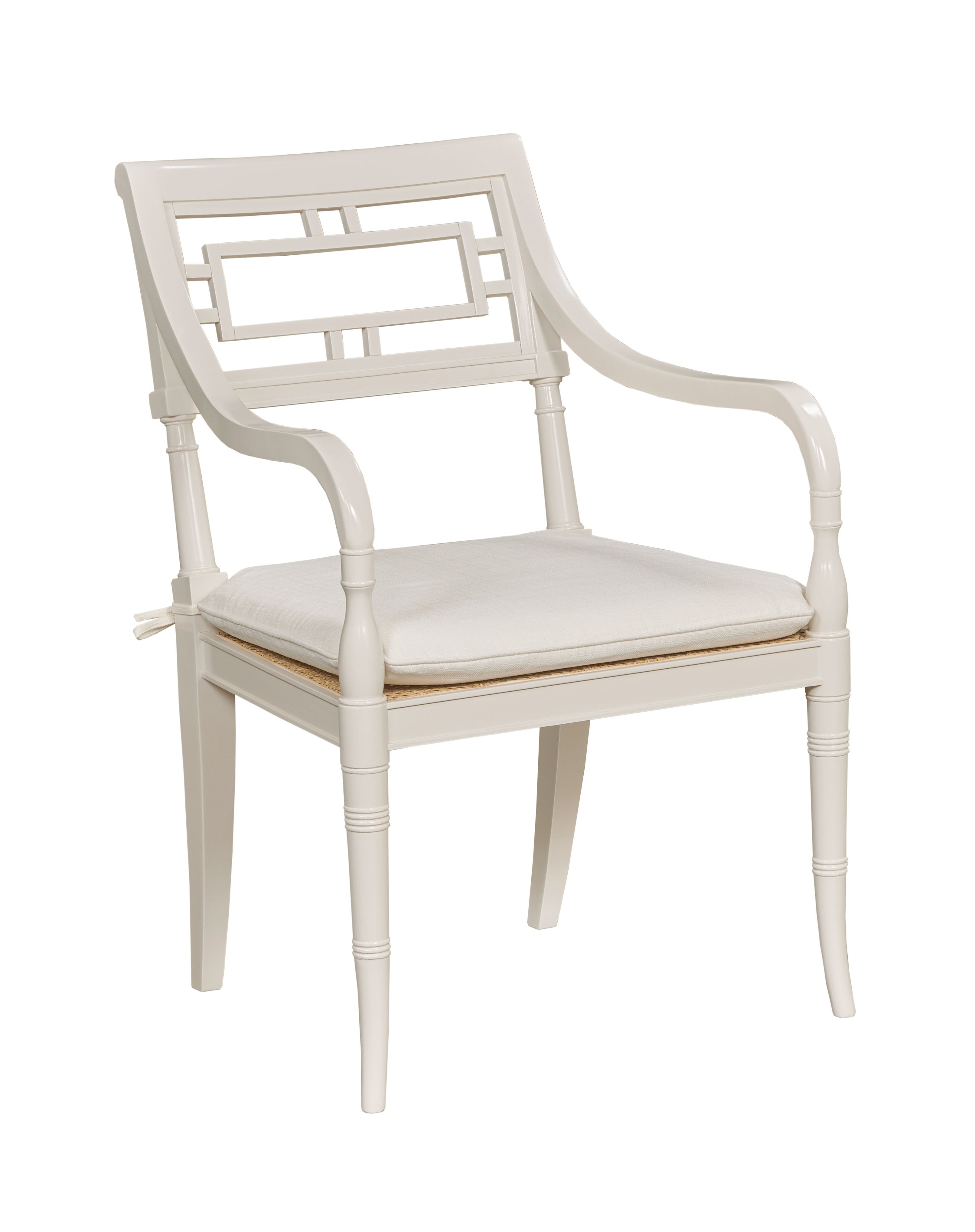White armchair with a cushion on a white background