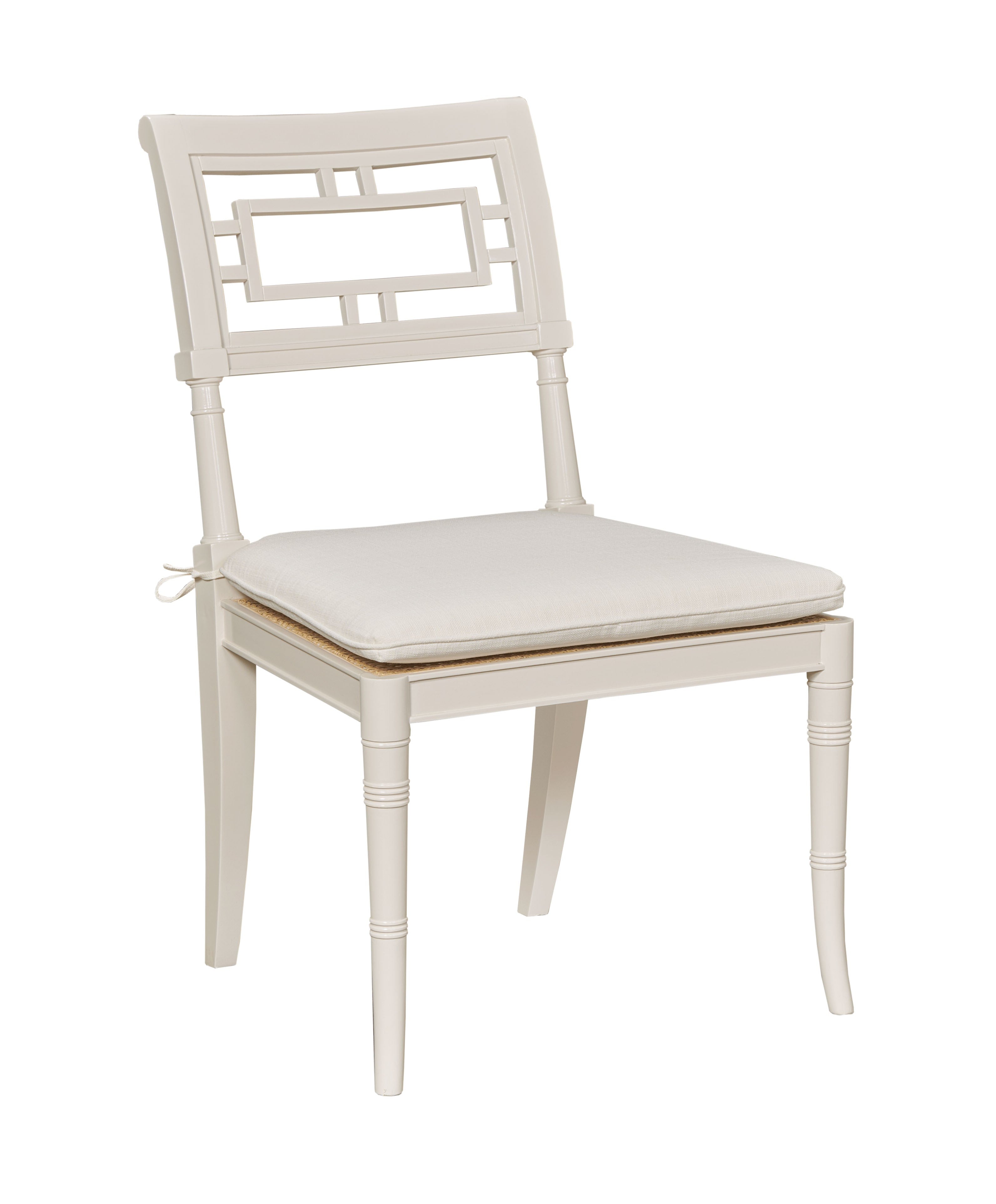 White chair with a cushioned seat on a white background
