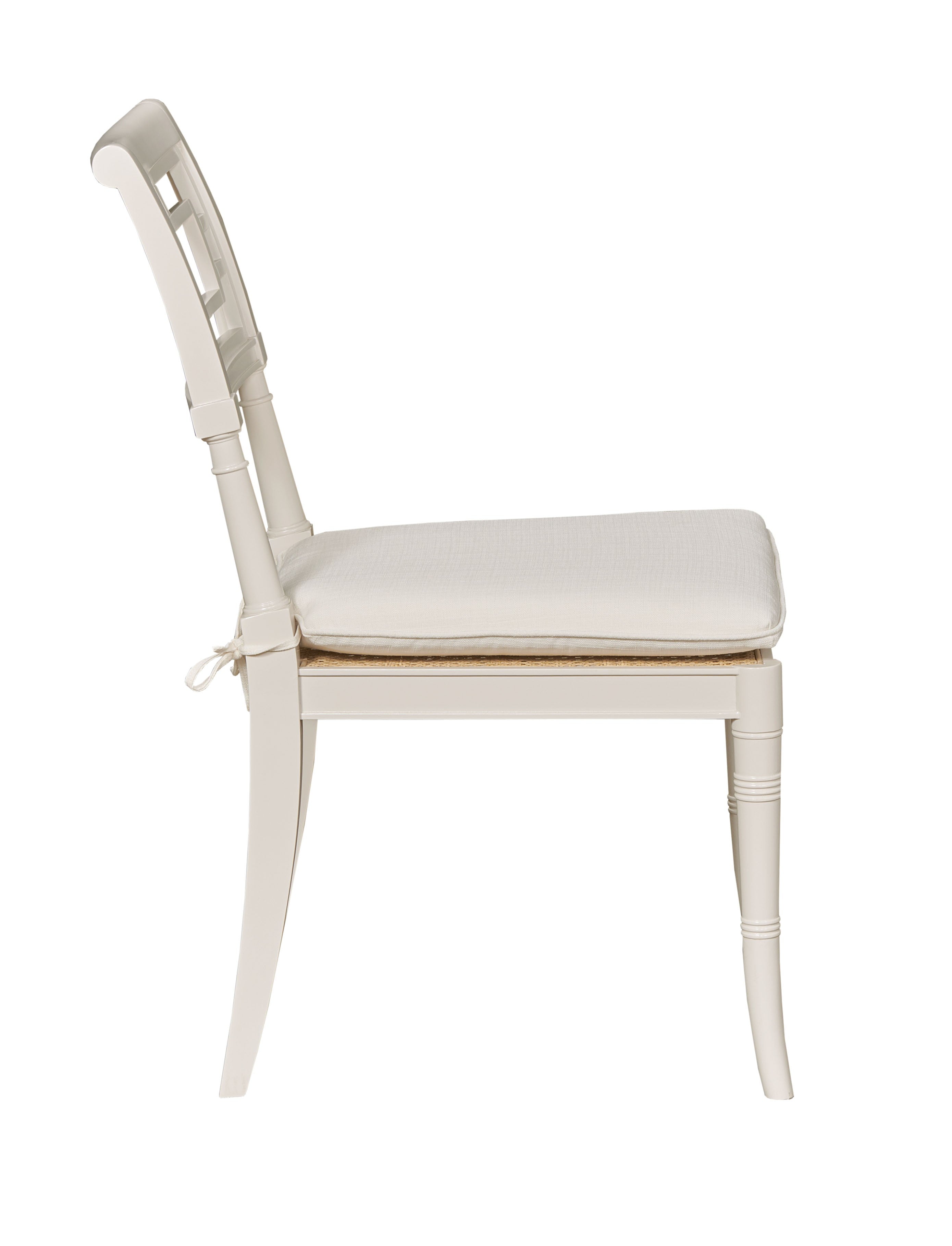 White chair with a cushion on a white background